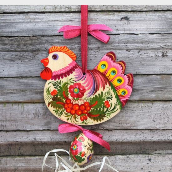 Rustic handmade Easter chicken with an egg -  wooden traditionel Easter ornaments