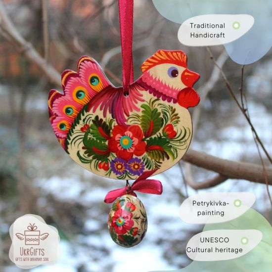 Rustic handmade Easter chicken with an egg -  wooden traditionel Easter ornaments