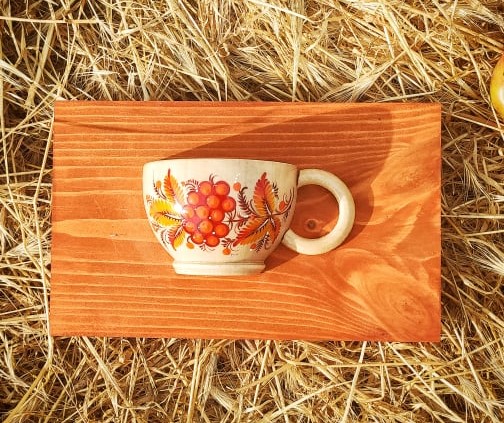 Rustic wooden wall deco, small cup with orange flowers