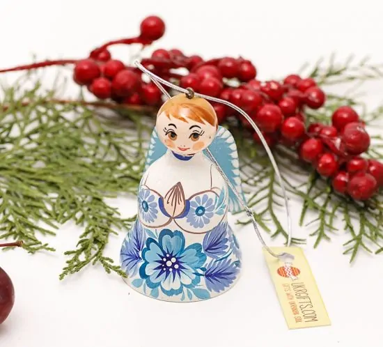 Christmas angel and bell made of wood, white and blue